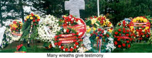 Many wreaths give testimony to past sacrifices (Remembrance in Kitchener)