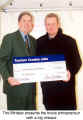 A cheque from the Minister [l.] to Sascha Lutz [r.]  (Toronto Christmas Market)