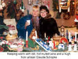 Keeping warm with red, hot mulled wine and a hug from artisan Claudia Schpke (Kitchener Christkindl Market)