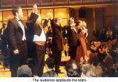 The audience applauds the stars