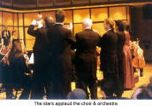 The stars applaud the choir & orchestra