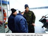 Captain Tony Gasperis in battle gear talks with the crew  [photo: Herwig Wandschneider]