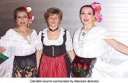 Danielle Bourre surrounded by Mexican dancers