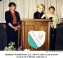 Teachers Elisabeth Kruse (l) & Clare Gunsch (r) are specially recognized by Monika Matthaes (c)