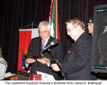 The Lieutenant Governor receives a momento from James R. Breithaupt