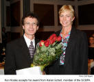 Ron Rodes accepts his award from Karen Scherl, member of the GCBPA [photo: Dolf Bogad]