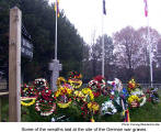 Some of the wreaths laid at the site of the German war graves  [photo: Herwig Wandschneider]