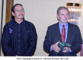 Henry Kataquapit presents Dr. Wendelin Ettmayer with a gift