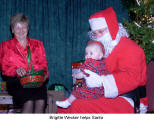 Brigitte Wecker helps Santa