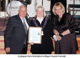 A plaque from Brampton's Mayor Susan Fennell (c.)