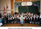 Singing as a choir to Ingrid's guidance with the guitar  [photo: Rachel Seilern]