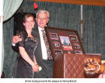 Annie Scully presents the plaque to Henry Betsch