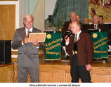 Henry Betsch receives a memorial plaque