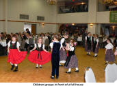 Children groups in front of a full house