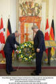 Prime Minister Stephen Harper and German Ambassador Dr. Georg Witschel place wreath on section of Berlin Wall